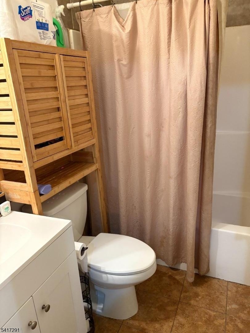 112 4th Avenue Paterson, NJ 07524 - Photo 14 of 20 a bathroom with a sink and a toilet