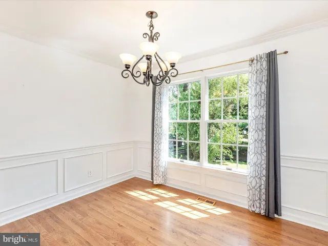 a view of a room with a large window