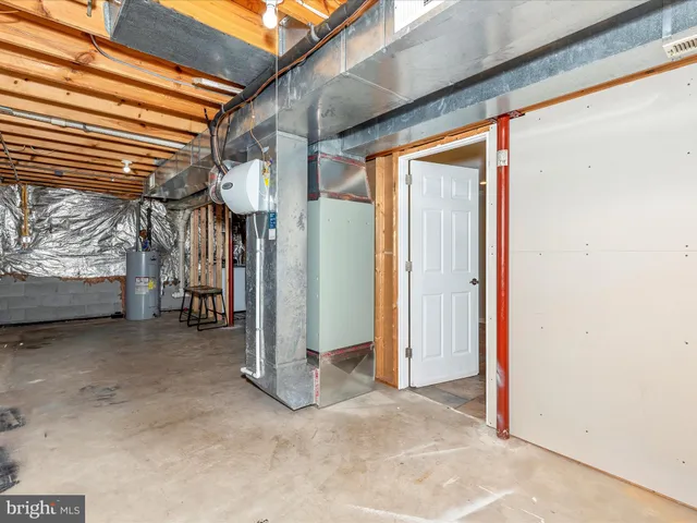 front view of house with large windows and a yard
