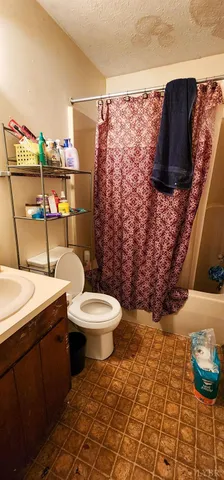 a kitchen with a refrigerator and washer