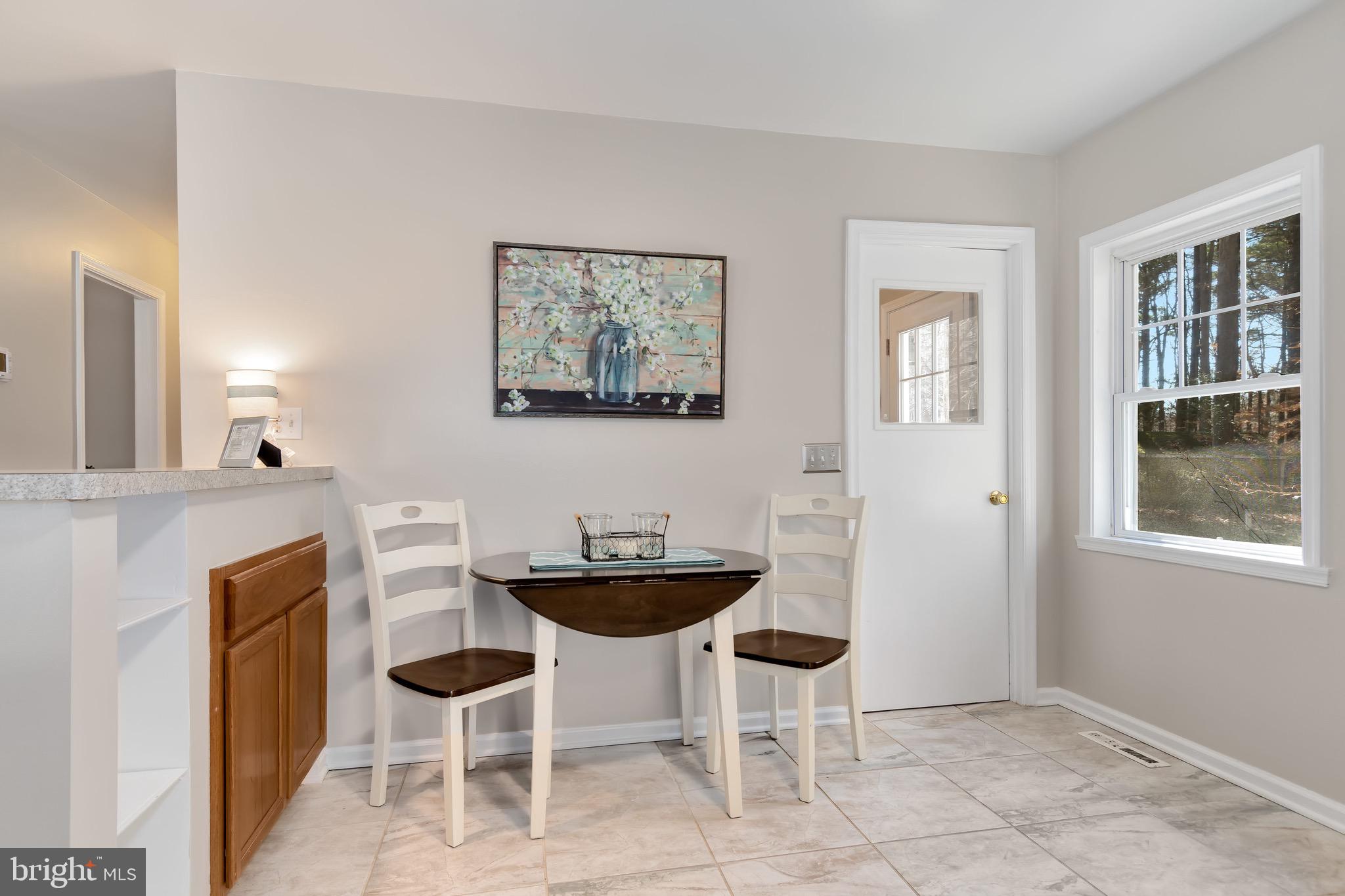 129 Forest Road Grasonville, MD 21638 - Photo 13 of 25 Eat in portion of kitchen, laundry door to right