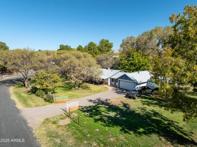 a view of a house with a backyard and a tub