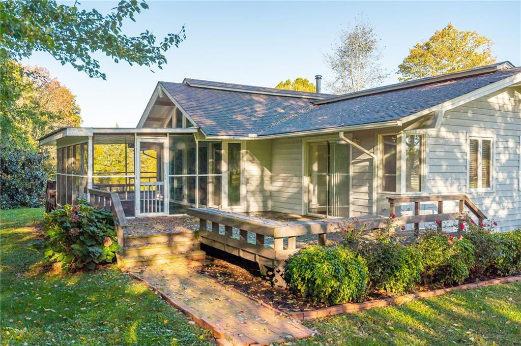 5723 Thom Road Graham, NC 27253 - Photo 2 of 36 Left Side View of decks and screen porch