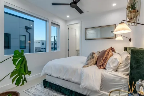 a bedroom with bed and a couch