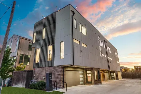 a front view of a building with a yard