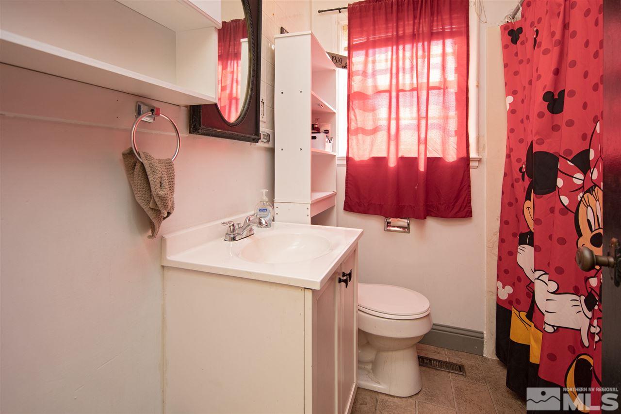 710 Balzar Circle Reno, NV 89502 - Photo 11 of 23 a bathroom with a sink toilet and mirror