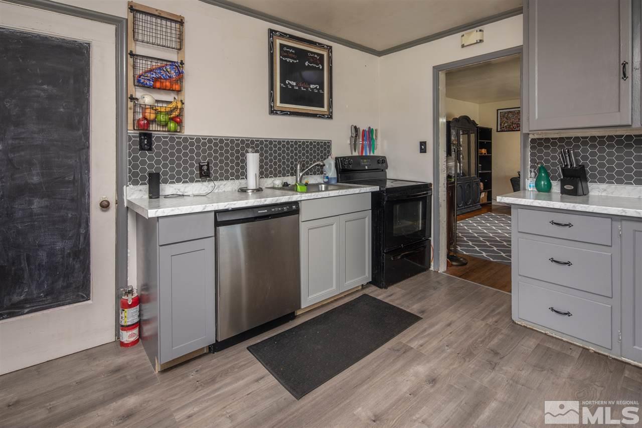 710 Balzar Circle Reno, NV 89502 - Photo 21 of 23 a kitchen with a sink cabinets and wooden floor