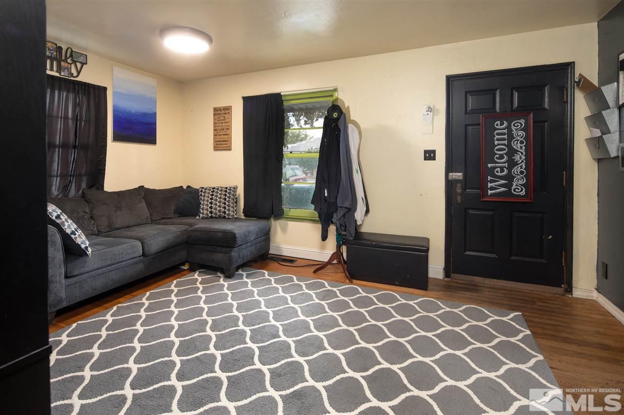 710 Balzar Circle Reno, NV 89502 - Photo 23 of 23 a living room with a couch and a mirror