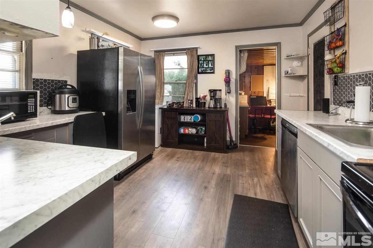 710 Balzar Circle Reno, NV 89502 - Photo 5 of 23 a kitchen with stainless steel appliances granite countertop a refrigerator stove and sink