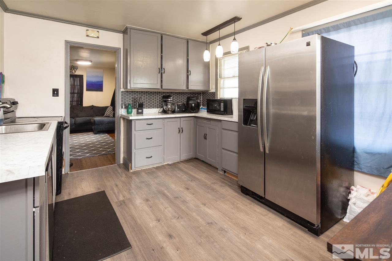 710 Balzar Circle Reno, NV 89502 - Photo 6 of 23 a kitchen with a refrigerator and a sink