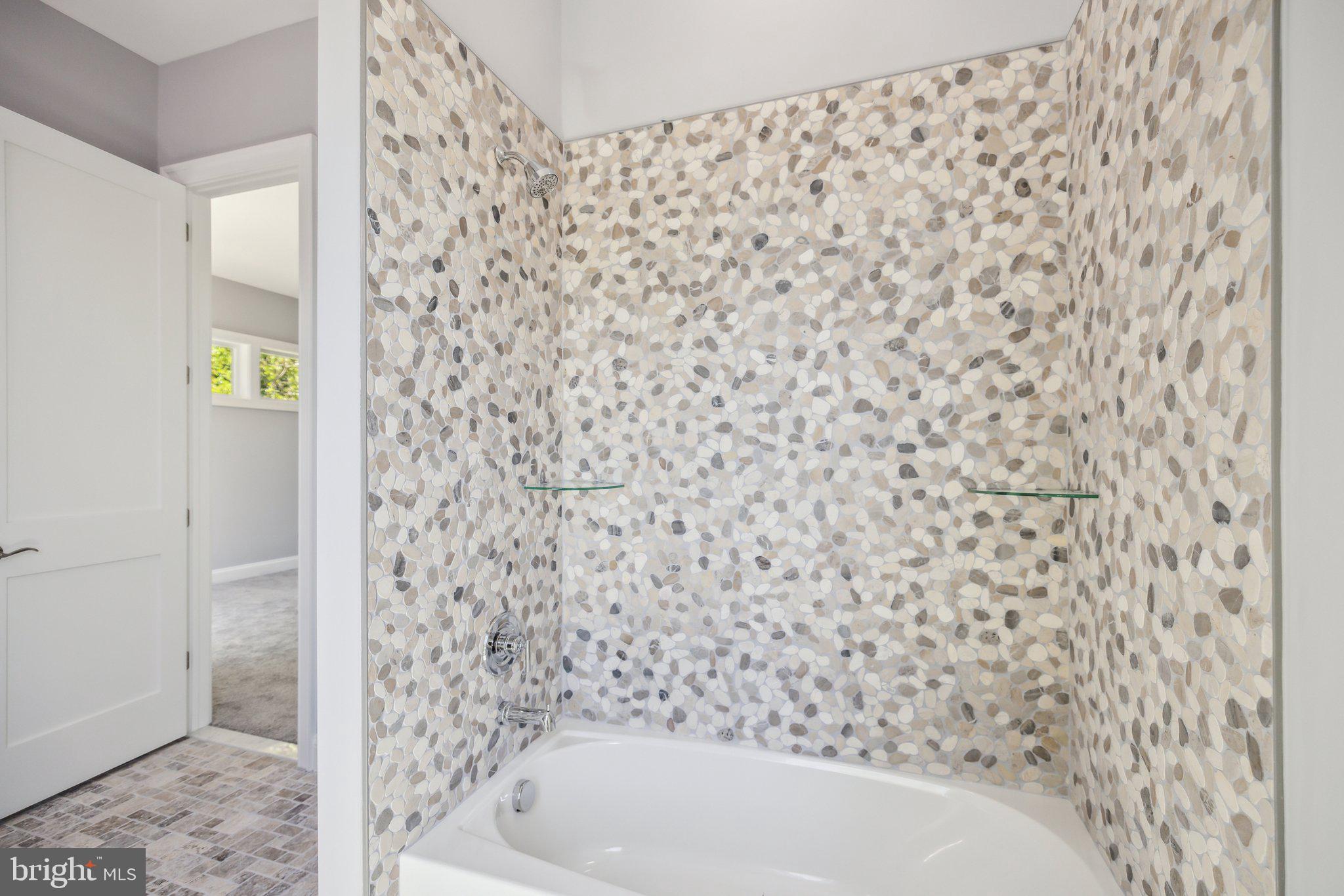 2811 21st Road South Arlington, VA 22206 - Photo 29 of 49 a bathroom with a bathtub and a shower curtain