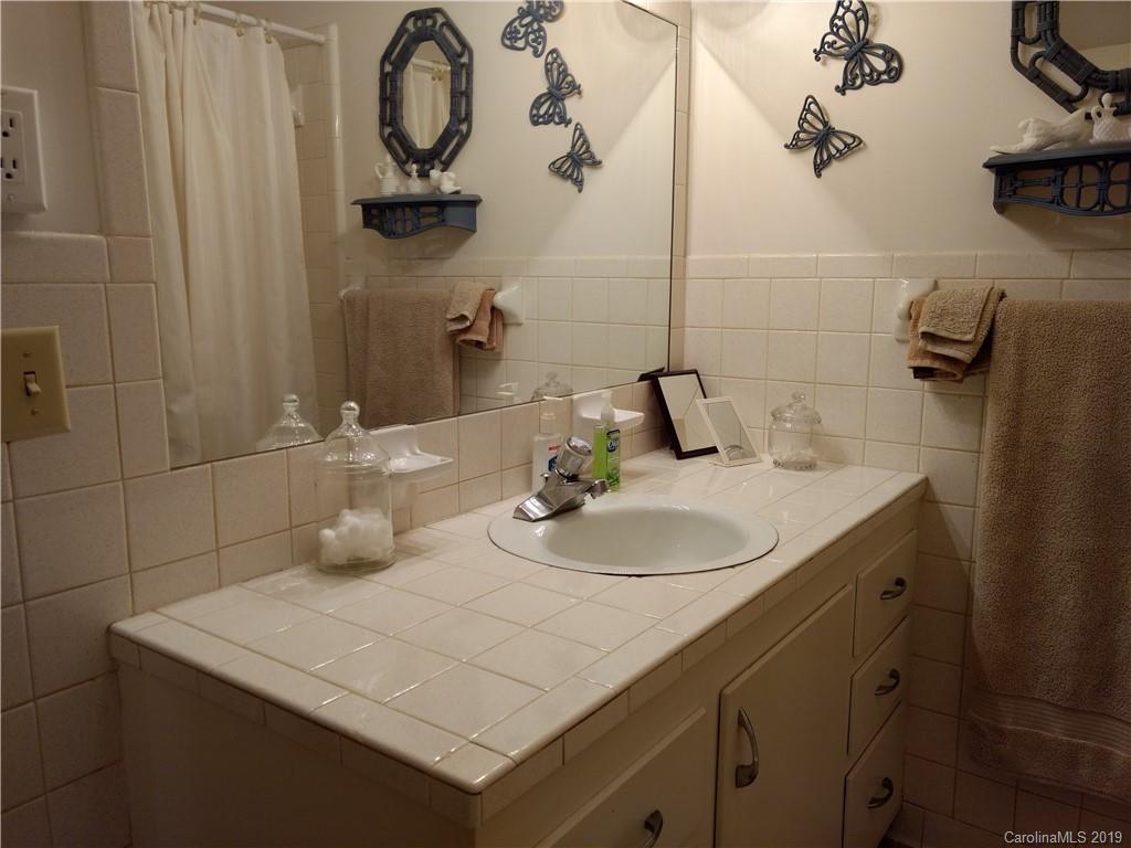 2703 Pearidge Road Bostic, NC 28018 - Photo 12 of 29 a bathroom with a sink and a mirror