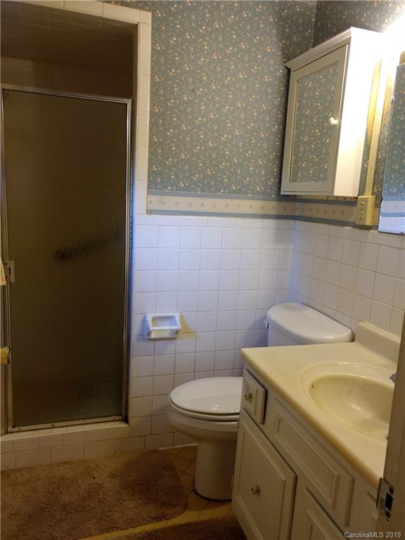 2703 Pearidge Road Bostic, NC 28018 - Photo 15 of 29 a bathroom with a toilet sink and mirror