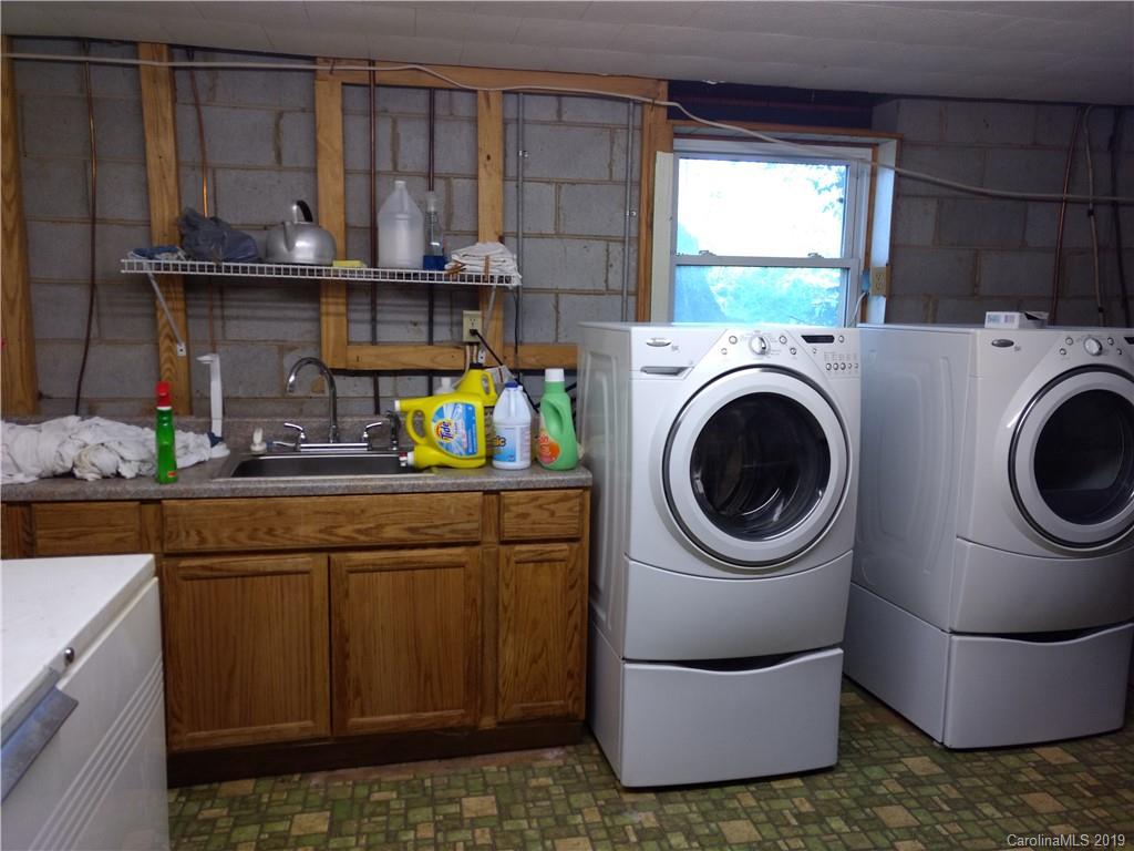 2703 Pearidge Road Bostic, NC 28018 - Photo 24 of 29 a kitchen with a sink a stove and cabinets