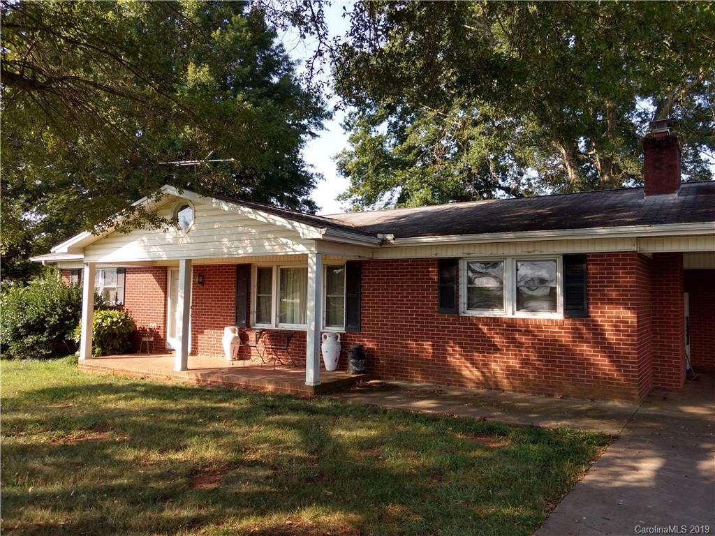 2703 Pearidge Road Bostic, NC 28018 - Photo 28 of 29 a front view of a house with a yard table and chairs