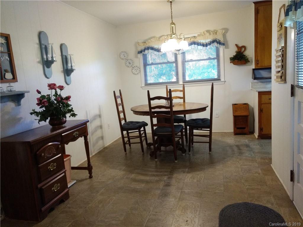 2703 Pearidge Road Bostic, NC 28018 - Photo 5 of 29 a view of a dining room with furniture and chandelier