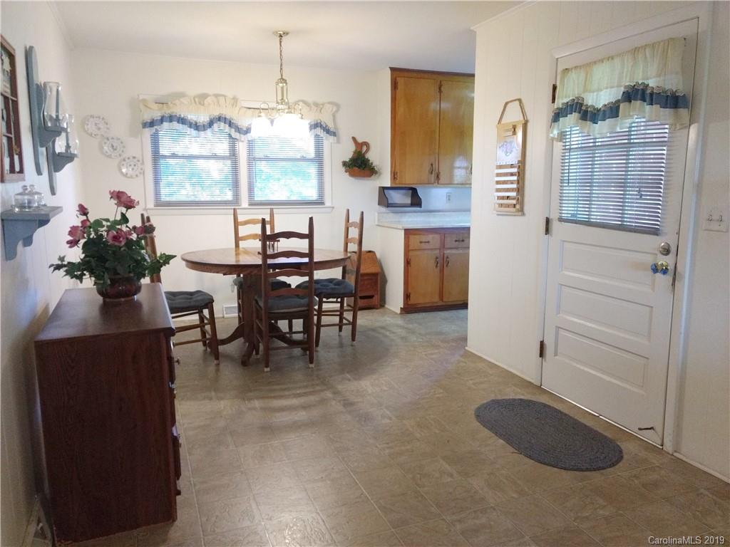 2703 Pearidge Road Bostic, NC 28018 - Photo 10 of 29 a view of a dining room with furniture and chandelier