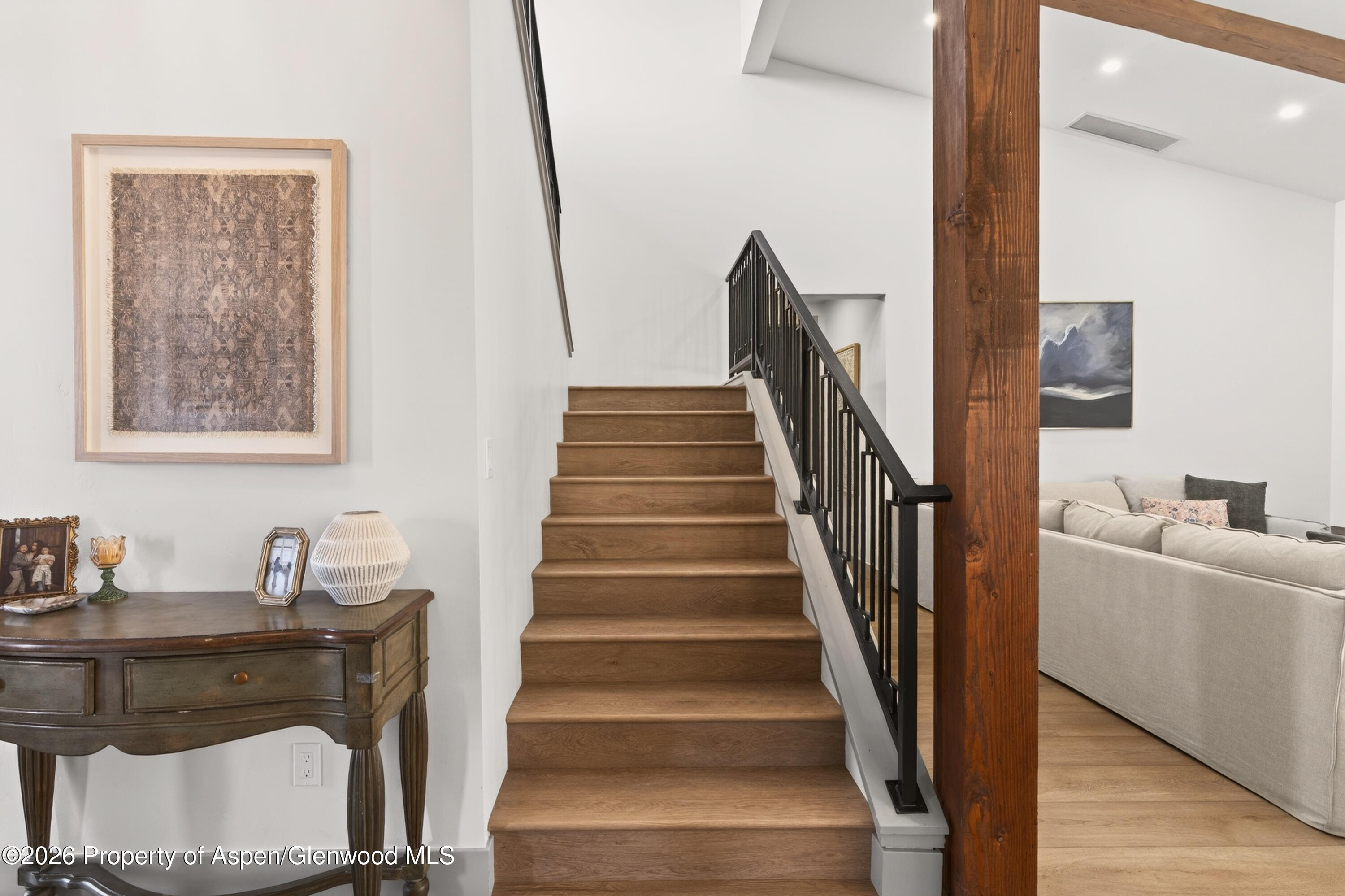 1395 Rifle Heights Drive Rifle, CO 81650 - Photo 22 of 35 a view of entryway and hall with wooden floor