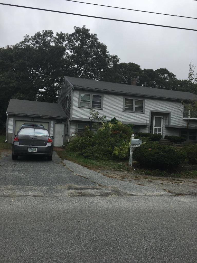 7 Quaker Road Hyannis, MA 02601 - Photo 1 of 20 a view of a car parked in front of a house