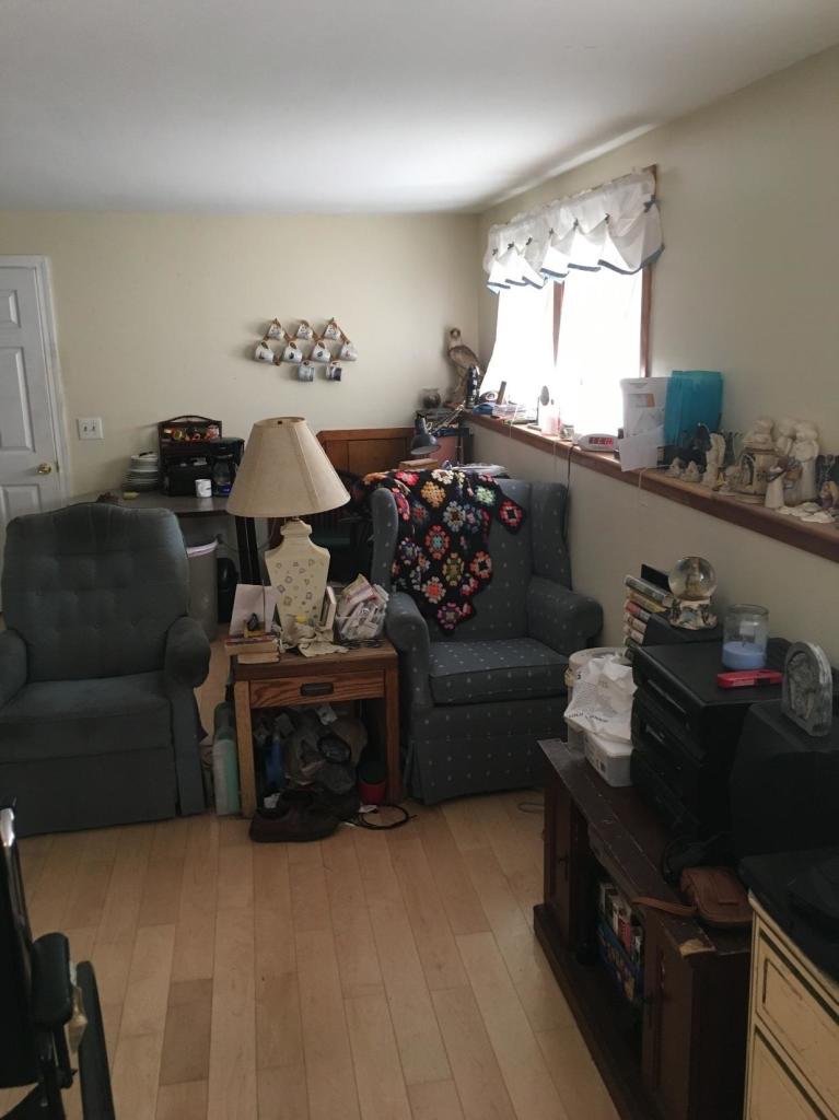 7 Quaker Road Hyannis, MA 02601 - Photo 17 of 20 a living room with furniture window and a table