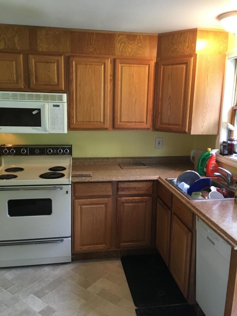 7 Quaker Road Hyannis, MA 02601 - Photo 3 of 20 a kitchen with a cabinets and white stove