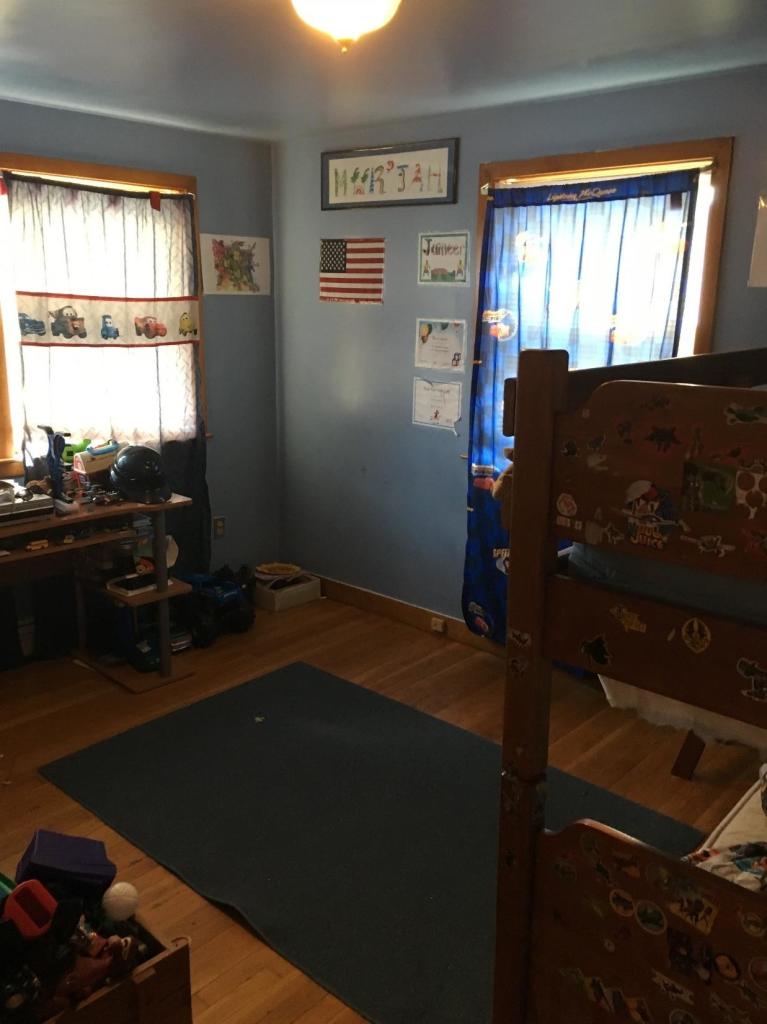 7 Quaker Road Hyannis, MA 02601 - Photo 7 of 20 a room with wooden floor and a window