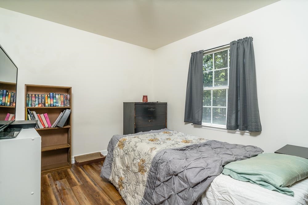 1139 Johnson Road Mineral, VA 23117 - Photo 15 of 33 a bedroom with a bed and a dresser next to a window