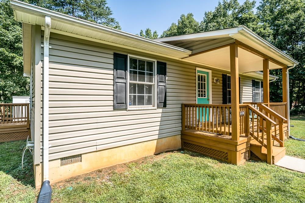 1139 Johnson Road Mineral, VA 23117 - Photo 2 of 33 a view of a house with a small yard and wooden fence