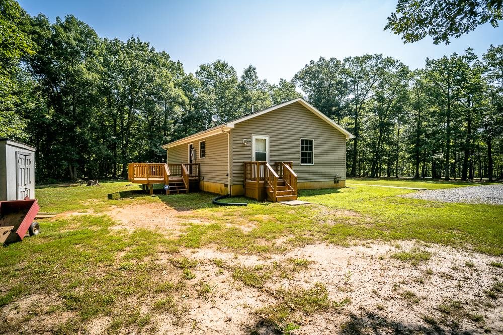 1139 Johnson Road Mineral, VA 23117 - Photo 25 of 33 a view of a house with pool and a yard