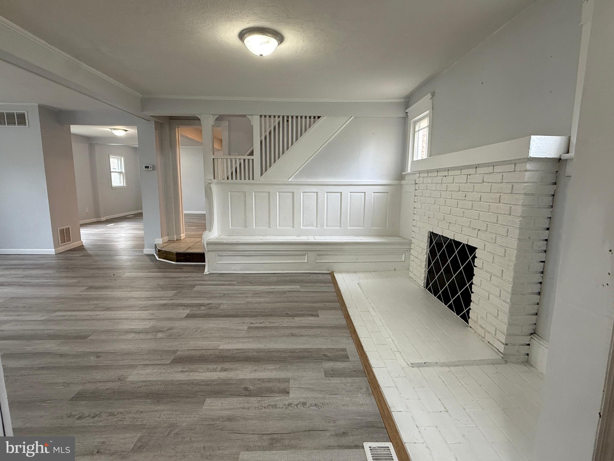 1036 South Spring Road Vineland, NJ 08361 - Photo 7 of 31 a view of dining room with stairs and wooden floor