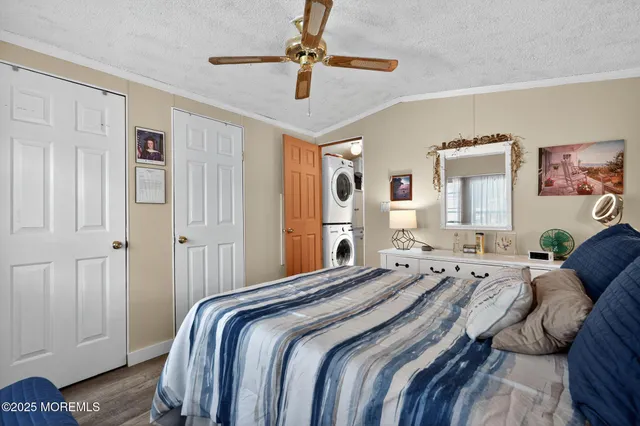 a bedroom with a bed and a chair in it