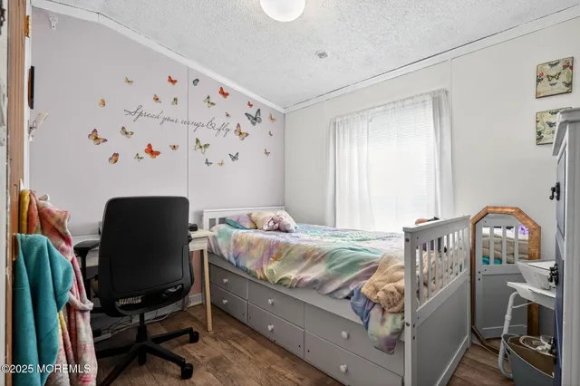 a bathroom with a sink a toilet and shower curtain