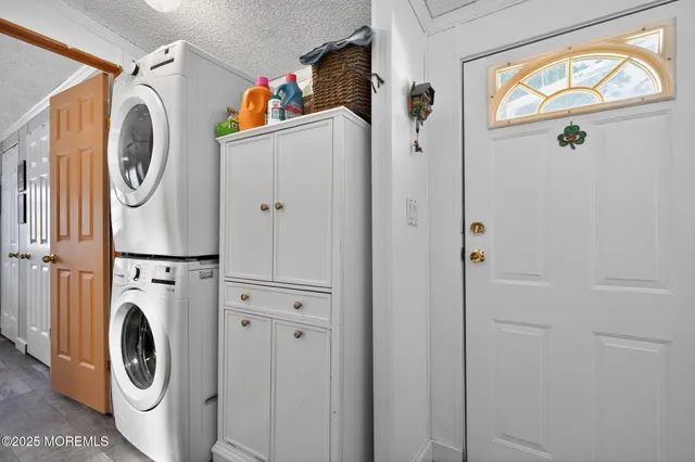 a view of a back yard of the house with a yard