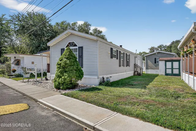 a view of backyard with a garden and deck