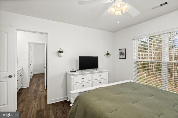 a room with furniture pool table and windows