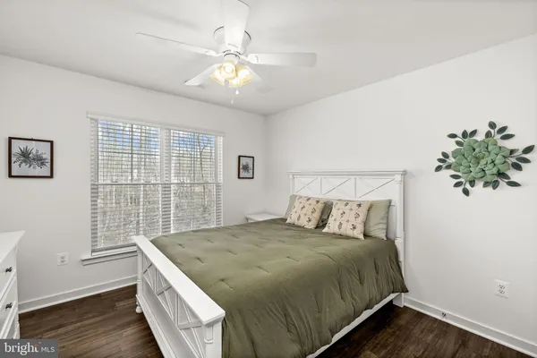 a living room with lots of furniture and white walls
