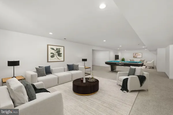 a front view of a house with a garden and yard