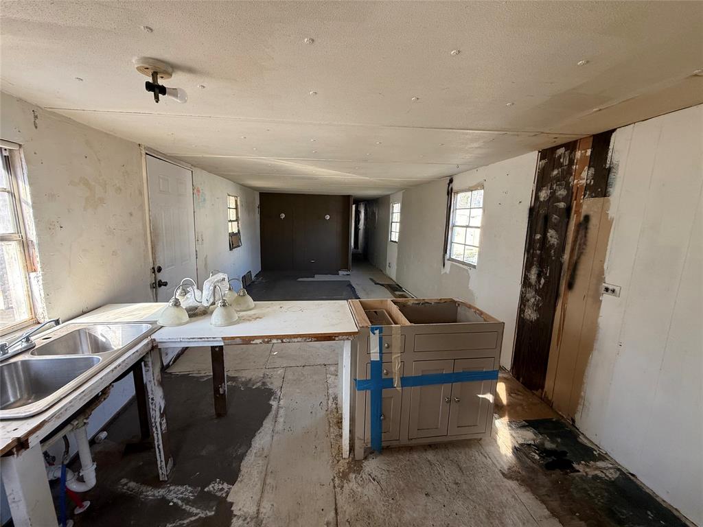 10300 Tanglewood Circle, Unit 1 Wills Point, TX 75169 - Photo 11 of 13 a view of a workspace with furniture and window