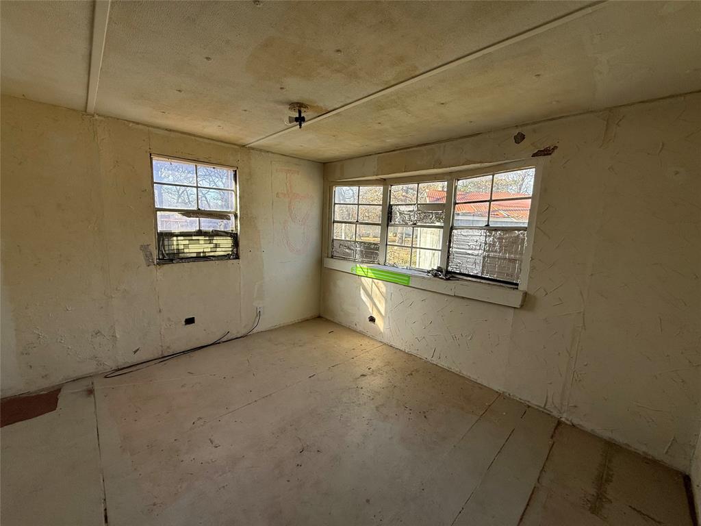 10300 Tanglewood Circle, Unit 1 Wills Point, TX 75169 - Photo 13 of 13 a view of an empty room with a window