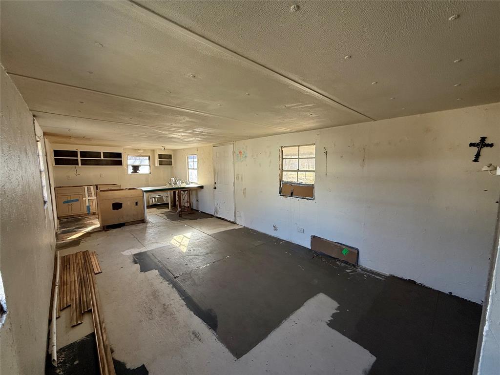 10300 Tanglewood Circle, Unit 1 Wills Point, TX 75169 - Photo 8 of 13 a view of kitchen with furniture and windows