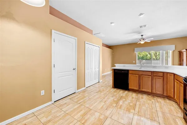 a large room with a large window and wooden floor