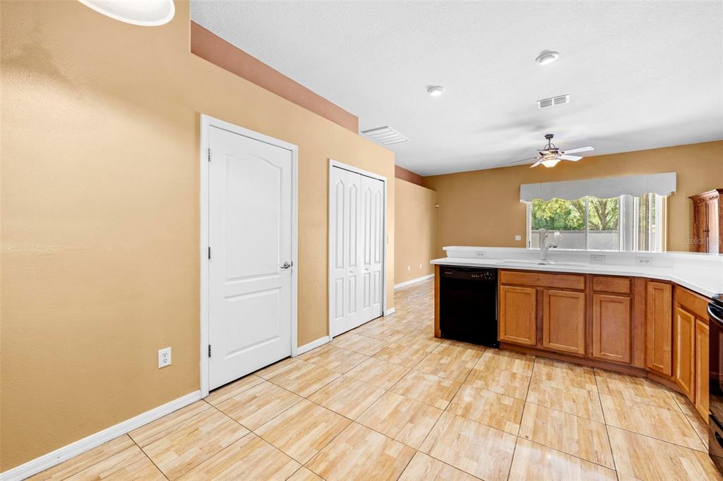4211 Blakemore Place Spring Hill, FL 34609 - Photo 14 of 42 a large room with a large window and wooden floor