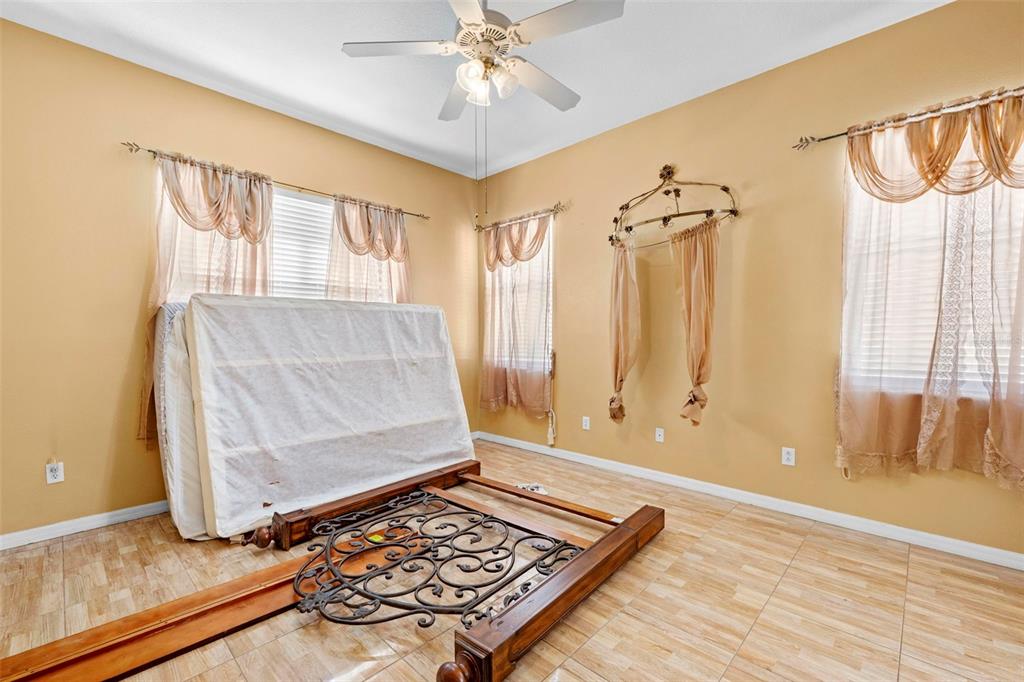 4211 Blakemore Place Spring Hill, FL 34609 - Photo 22 of 42 a living room with a couch and a table