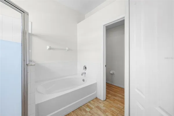a bathroom with a bathtub and shower