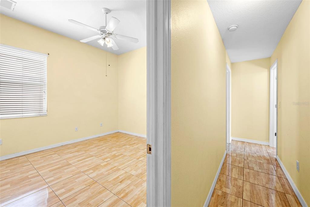 4211 Blakemore Place Spring Hill, FL 34609 - Photo 29 of 42 a view of a hallway with wooden floor