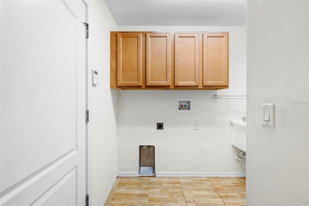 4211 Blakemore Place Spring Hill, FL 34609 - Photo 36 of 42 a bathroom with a sink