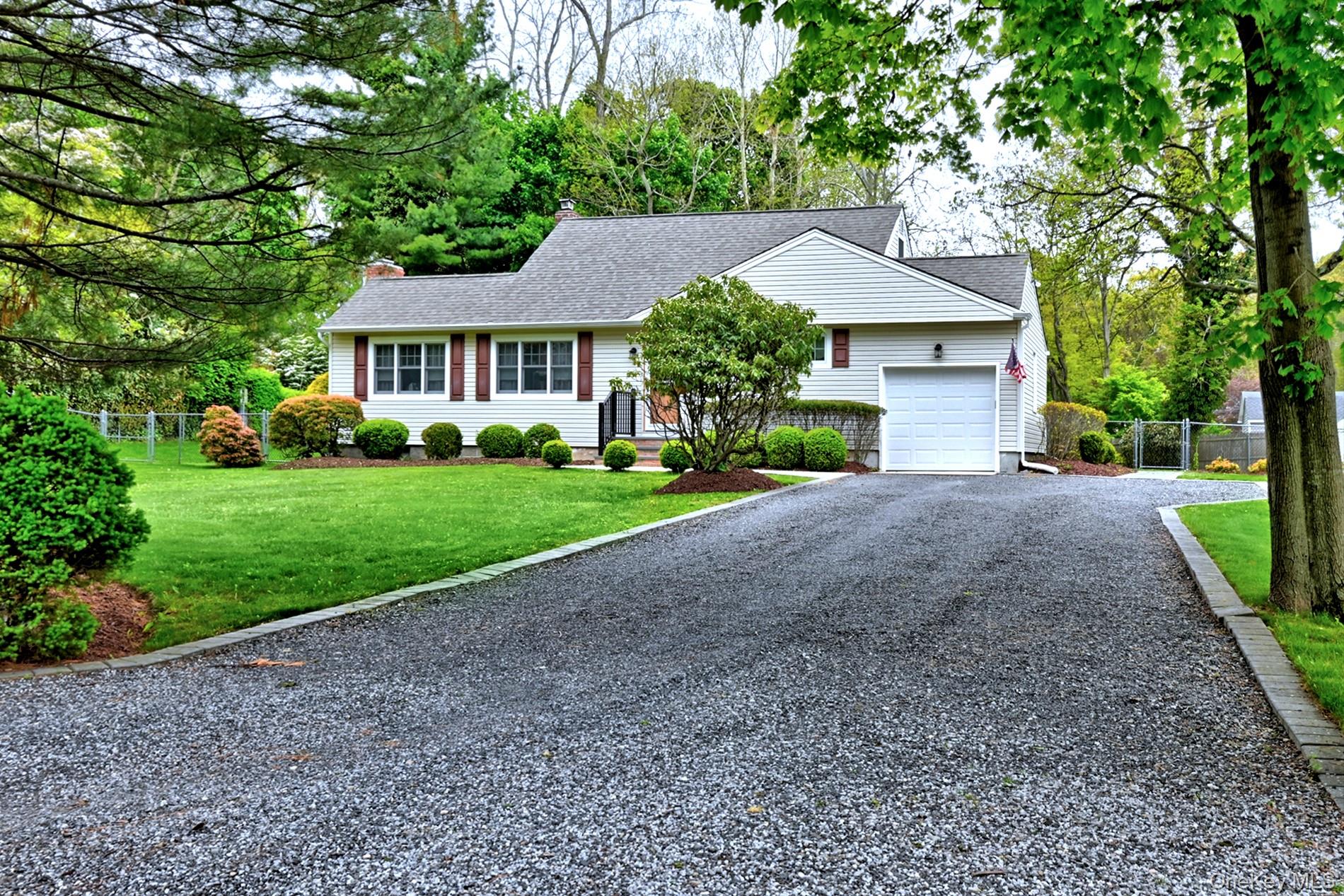 20 Valentine Road Shoreham, NY 11786 - Photo 2 of 39 Extra Wide Driveway Leads to the Oversized Garage. Home is Close to the Private Beach
