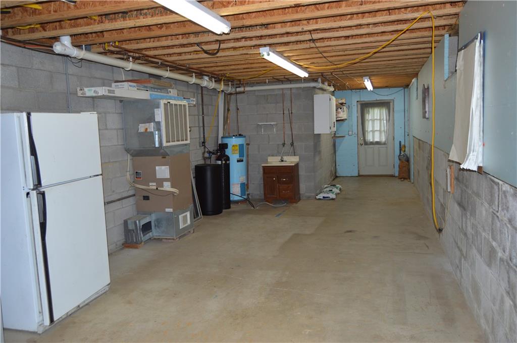 3244 Maple Lane Jamestown, PA 16134 - Photo 19 of 27 a view of a storage & utility room with refrigerator and a window