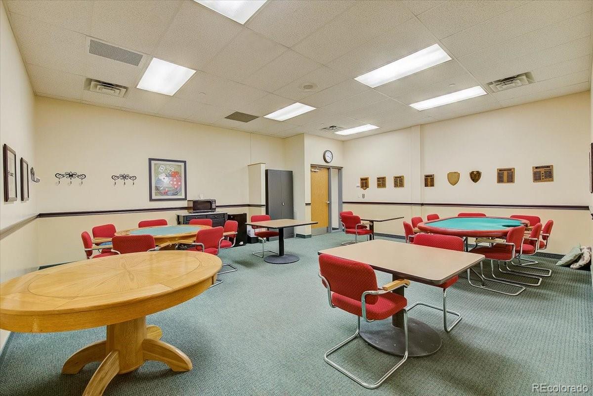 9625 Center Avenue, Unit 7B Denver, CO 80247 - Photo 39 of 49 a living room with furniture and a table