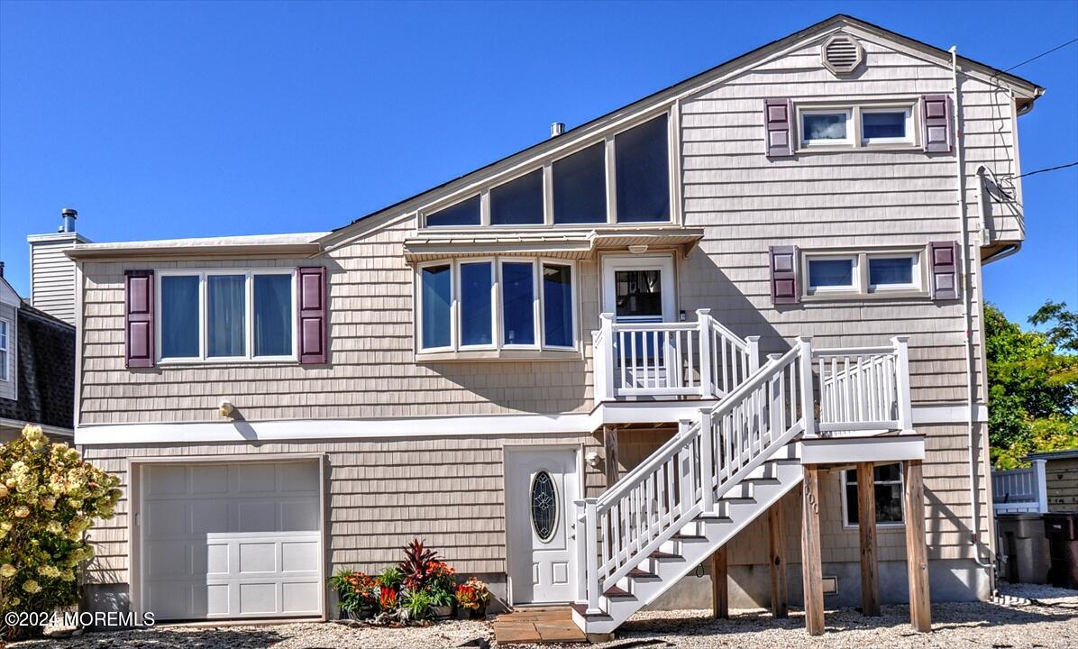 100 Cedar Run Road Bayville, NJ 08721 - Photo 11 of 39 a front view of a house with a yard